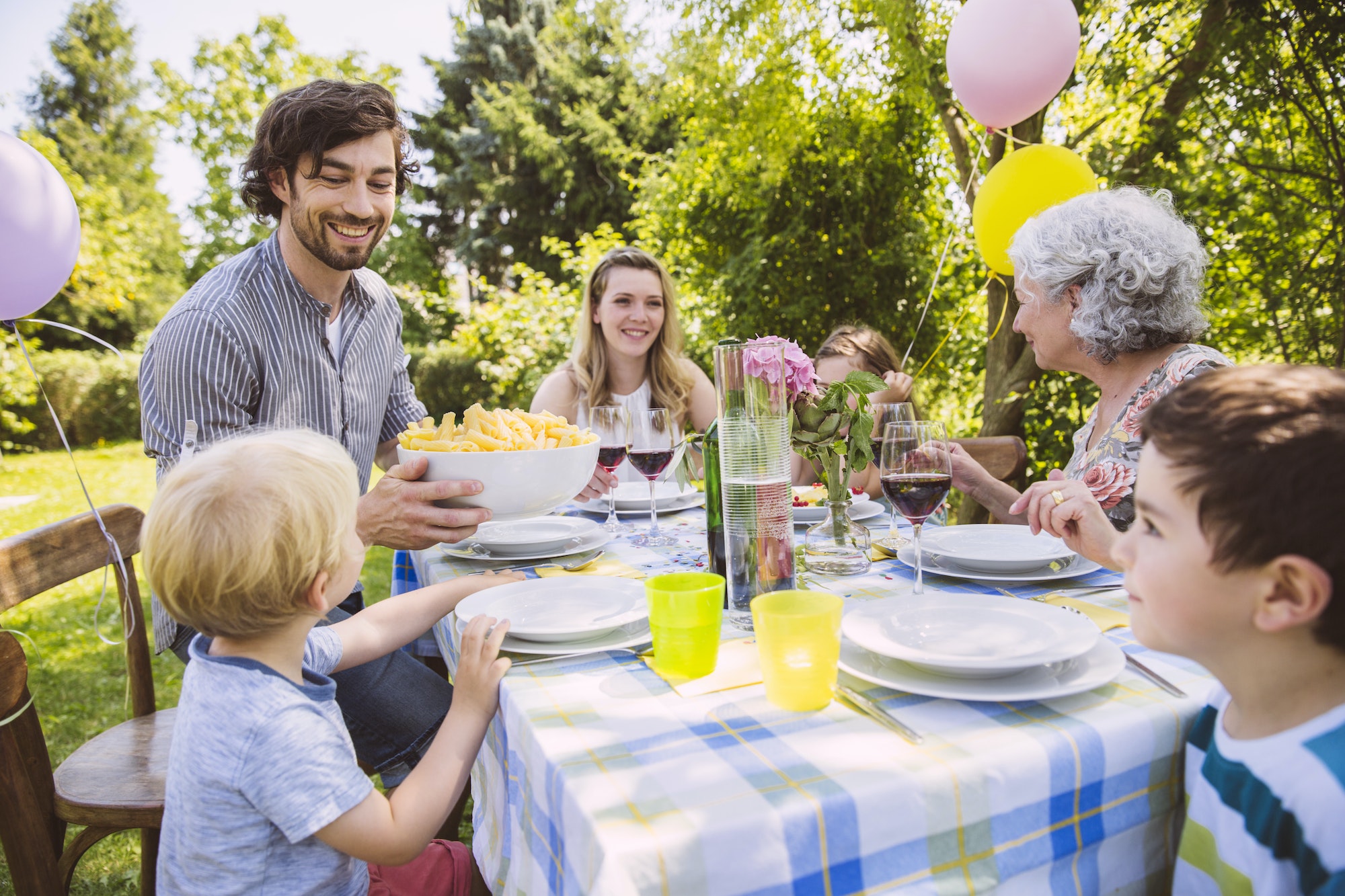 Family of three generations at a garden party